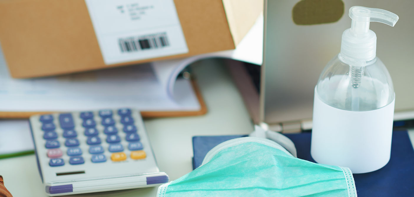 Busy Desktop and Face Mask and Hand Sanitiser